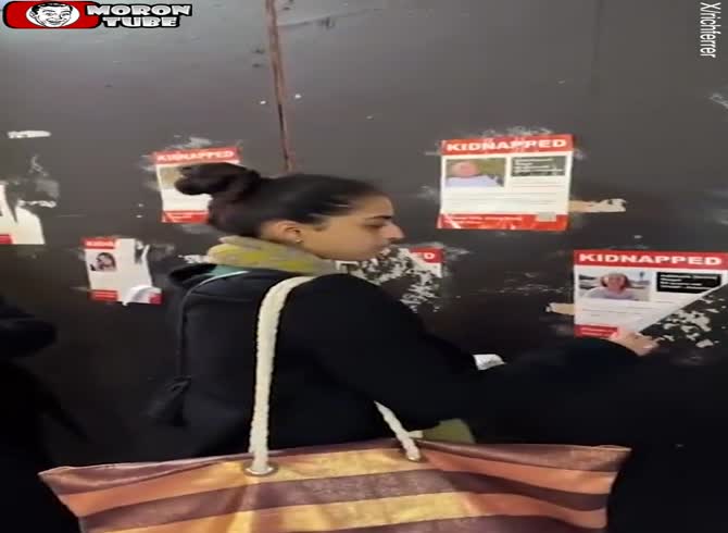 Video :Supporters of Palestine demolish posters depicting Israeli women and children who have been abducted